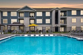 Greenwood apartment for rent - Pool At Dusk at Arlington Farms, Greenwood, IN, 46143