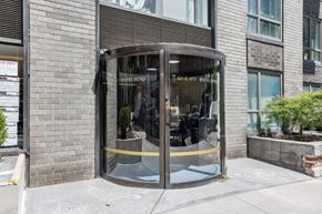 New York apartment for rent - A glass door with a yellow line on the bottom of it.