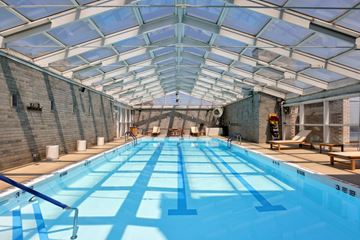 New York apartment for rent - A large indoor swimming pool with a glass ceiling.