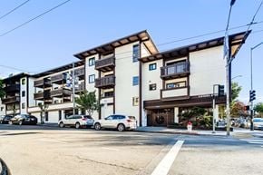 San Francisco apartment for rent - an empty street with cars parked in front of an apartment building