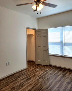 Springdale apartment for rent - a bedroom with a door and a ceiling fan