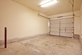 Junction City triplex for rent - an empty garage with white walls and a garage door