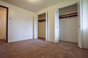 Eugene apartment for rent - A room with a carpeted floor and a closet with a shelf.
