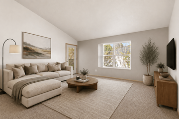 Eugene apartment for rent - A living room with a couch, coffee table, and a painting on the wall.