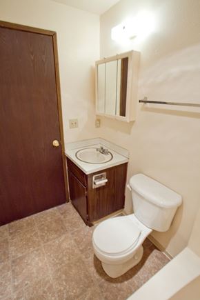 Eugene apartment for rent - A white toilet sits next to a sink in a small bathroom.