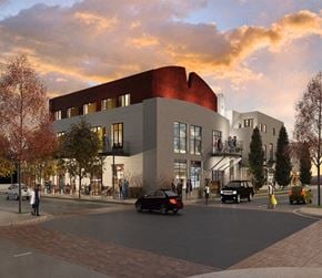 Albuquerque apartment for rent - a rendering of a building with a curved roof and a street with cars