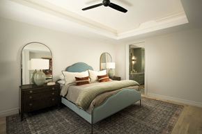 Phoenix apartment for rent - A bedroom with a bed, dresser, mirror, and rug.