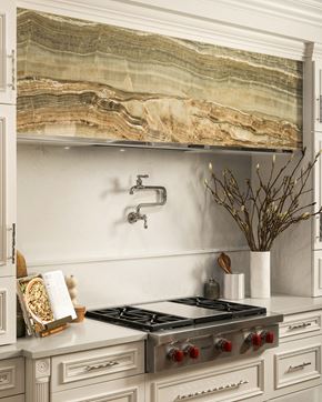 Phoenix apartment for rent - A kitchen with a marble backsplash and a stove top oven.