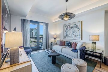 Atlanta apartment for rent - a living room with a couch and a door to a balcony