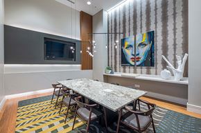 Atlanta apartment for rent - a dining room table with chairs and a painting on the wall