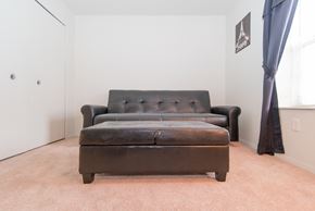 Pontiac apartment for rent - a living room with a leather couch and a