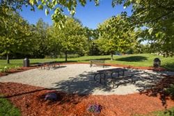 Pontiac apartment for rent - a picnic area in a park with a table and benches