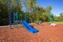 Pontiac apartment for rent - a playground with a blue slide and a pink pig