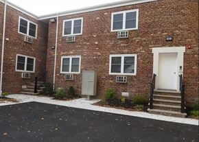 Newark apartment for rent - a brick building with a white door and stairs