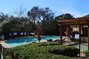 Dallas apartment for rent - Pool area with wooden pergola and orange umbrellas at Overton Park Apartments, Dallas, 75216