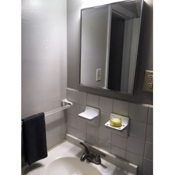 Marietta apartment for rent - A white refrigerator is in a kitchen with white cabinets.