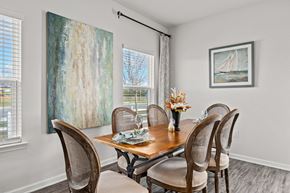 Lynn Haven townhouse for rent - a dining room with a wooden table and chairs