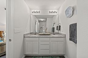 Lynn Haven townhouse for rent - a bathroom with a sink and a mirror