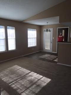 Lawrenceville apartment for rent - A room with a carpeted floor and a door.