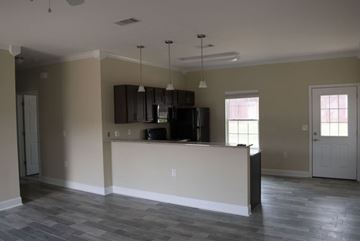 Texarkana apartment for rent - A kitchen area with a counter and cabinets.