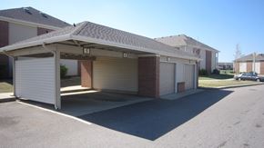 Memphis apartment for rent - A garage with a brick wall and a white door is labeled with the number 5.