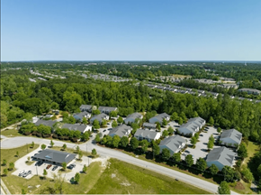 Augusta apartment for rent - A bird's eye view of a residential area with houses and a community center.