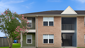 Lafayette apartment for rent - A brick building with a balcony on the second floor.