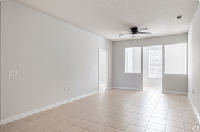 Pembroke apartment for rent - Empty room with a ceiling fan and tiled floor.