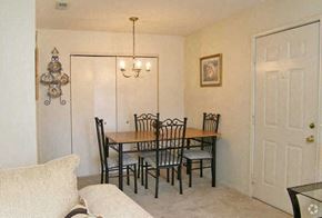 Greenville townhouse for rent - a dining room with a table and a couch