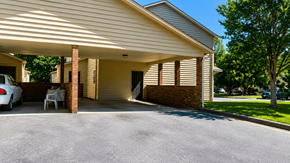 Hickory apartment for rent - A house with a garage and a car parked in front.