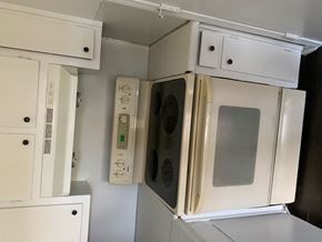 Atlanta apartment for rent - A white microwave oven with its door open and control panel visible.