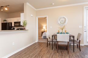 Zachary apartment for rent - A dining room with a table set for four.