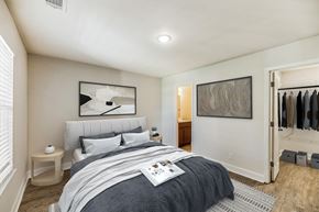Savannah townhouse for rent - a bedroom with a bed and a closet