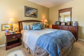 Greenville apartment for rent - a bedroom with a large bed and two nightstands