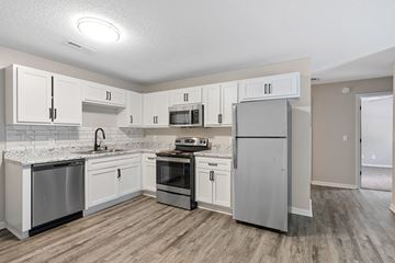 Anderson apartment for rent - A kitchen with white cabinets and stainless steel appliances.