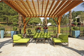 Stockbridge apartment for rent - A wooden pergola with green cushioned seating.