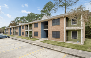 Lafayette apartment for rent - A row of apartment buildings with a car parked in front.
