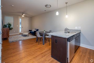 Nashville apartment for rent - a kitchen and living room with an island and a dining table