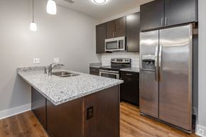 Nashville apartment for rent - a kitchen with stainless steel appliances and a granite counter top