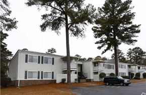 Macon apartment for rent - a car is parked in front of an apartment building
