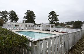 Macon apartment for rent - a pool with a white fence around it