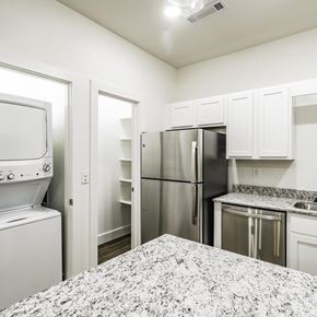 Bentonville apartment for rent - a kitchen with granite countertops and stainless steel appliances