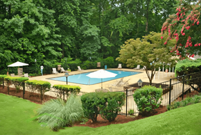 Covington apartment for rent - a backyard with a swimming pool and a wrought iron fence
