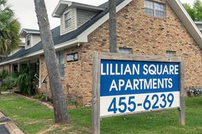 Pensacola apartment for rent - A sign for Lillian Square Apartments with a phone number on it.
