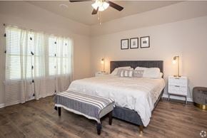 Maurice apartment for rent - a bedroom with a bed and a ceiling fan