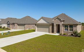 Maurice apartment for rent - a house in a subdivision with a sidewalk and grass