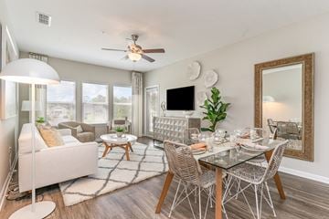 Myrtle Beach apartment for rent - a living room with a dining room table and a ceiling fan