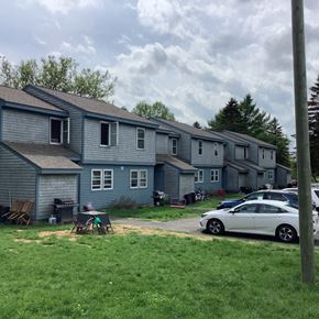 Caribou apartment for rent - a house with a car parked in front of it