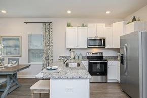 Crestview townhouse for rent - a kitchen with stainless steel appliances and a granite counter top