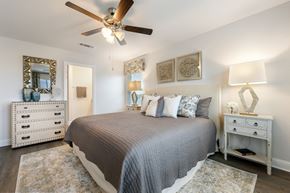 Crestview townhouse for rent - the preserve at ballantyne commons spacious bedroom with bed and ceiling fan
